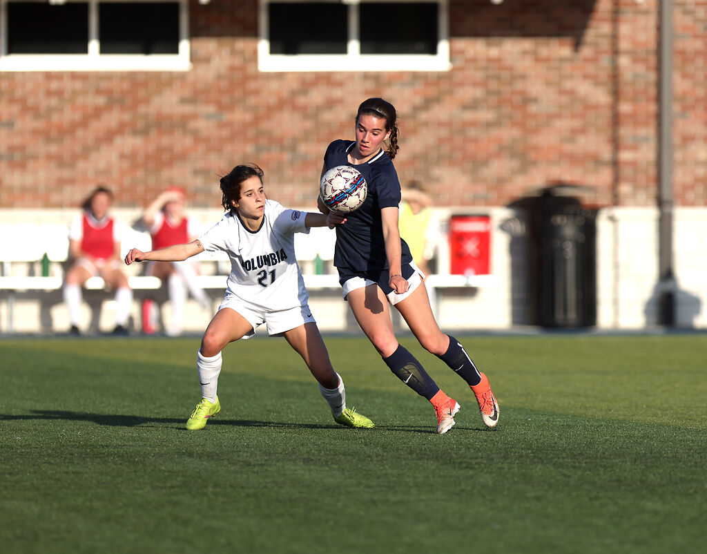 Players fight for possession of the ball